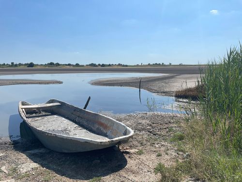 Fishing boat in a dry wetland